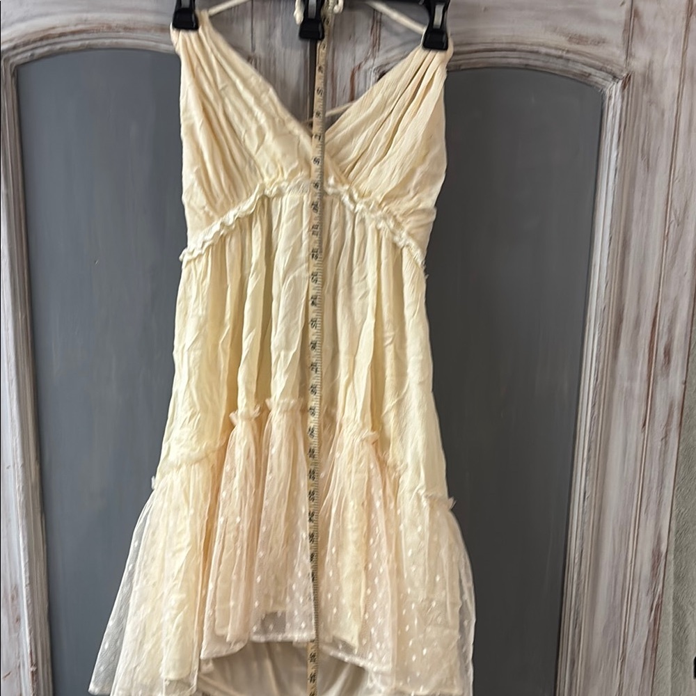 Cream Sleeveless Dress with Polka Dot Detail